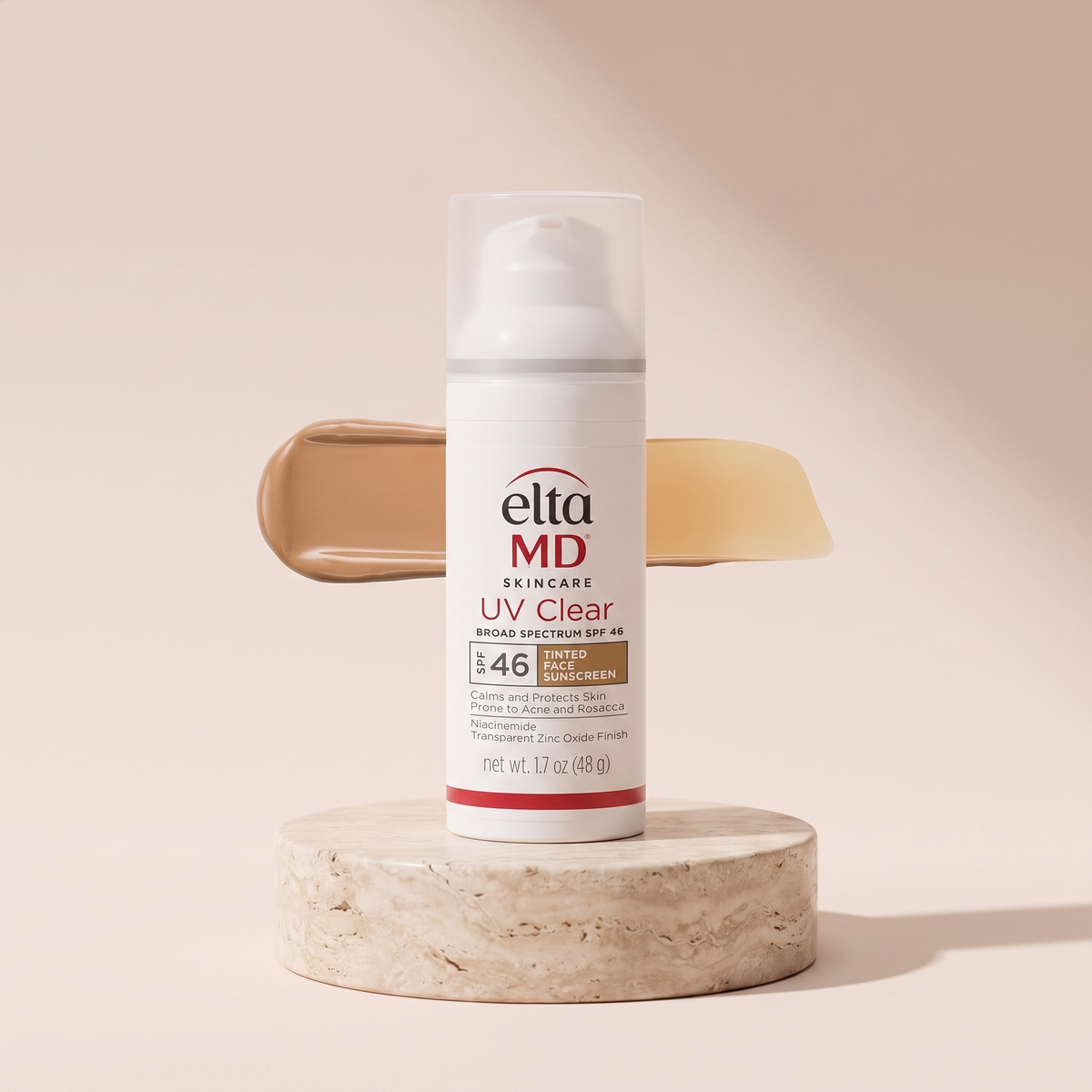 EltaMD UV Clear Tinted Sunscreen SPF 46 styled on travertine pedestal, blush studio