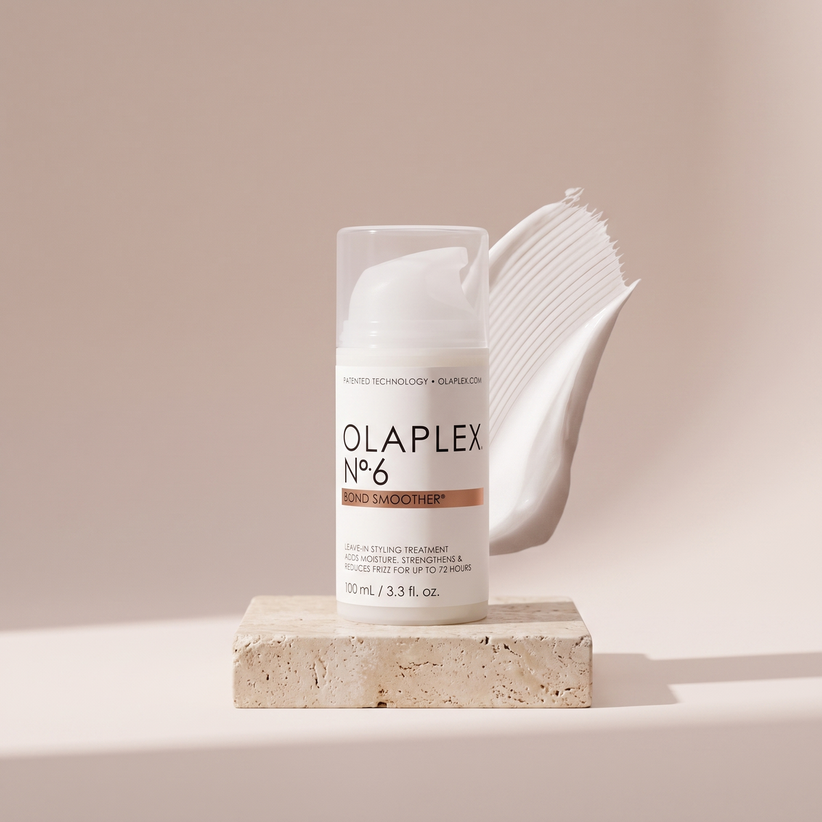 Olaplex No. 6 Bond Smoother styled on travertine pedestal, blush studio