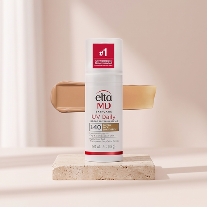 EltaMD UV Daily Tinted Sunscreen SPF 40 styled on travertine pedestal, blush studio