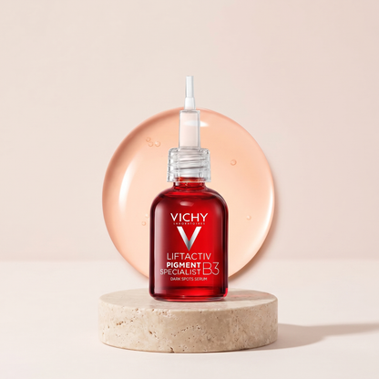 Vichy LiftActiv Specialist B3 Serum styled on travertine pedestal, blush studio