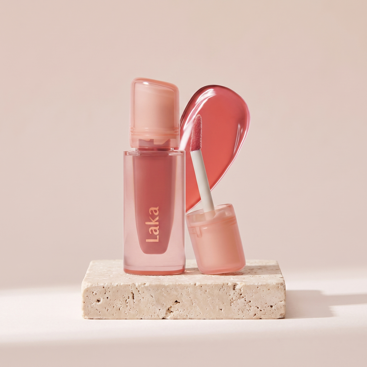 Laka Jelling Nude Gloss styled on travertine pedestal, blush studio