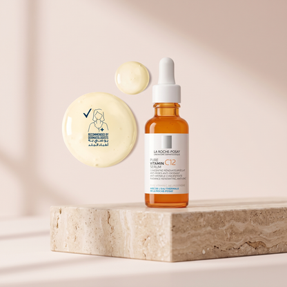 La Roche-Posay 12 Vitamin C Brightening Serum styled on travertine pedestal, blush studio