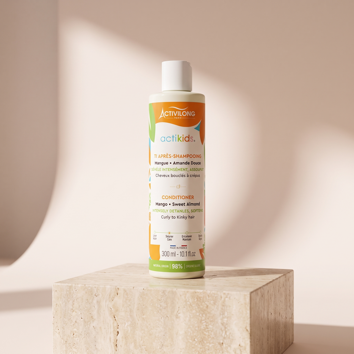 Activilong Actikids Conditioner 250 ml styled on travertine pedestal, blush studio
