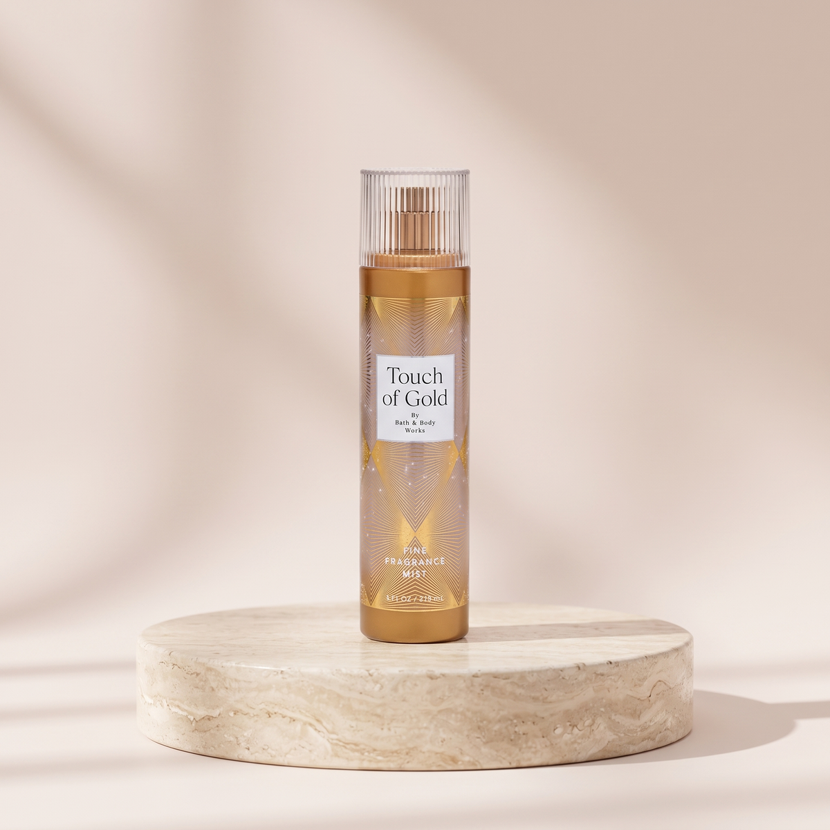 Bath and Body Works Touch of Gold Fine Fragrance Mist 236 ml styled on travertine pedestal, blush studio
