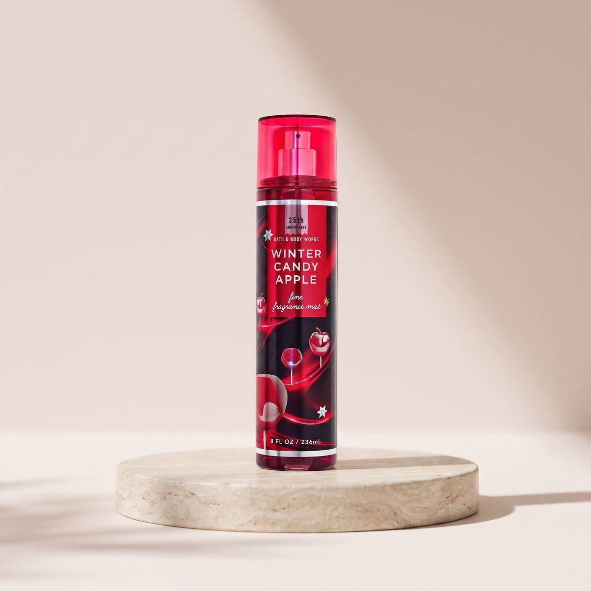 Bath and Body Works Winter Candy Apple Fine Fragrance Mist 236 ml styled on travertine pedestal, blush studio