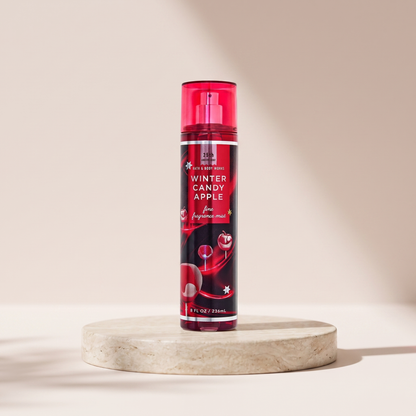Bath and Body Works Winter Candy Apple Fine Fragrance Mist 236 ml styled on travertine pedestal, blush studio