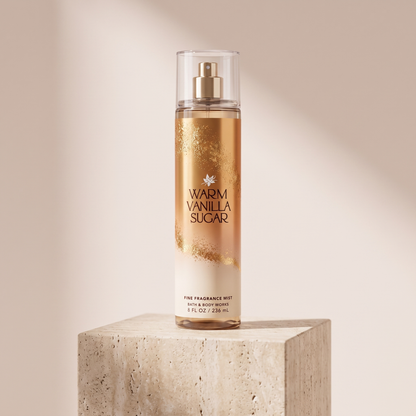Bath and Body Works Warm Vanilla Sugar Fine Fragrance Mist 236 ml styled on travertine pedestal, blush studio
