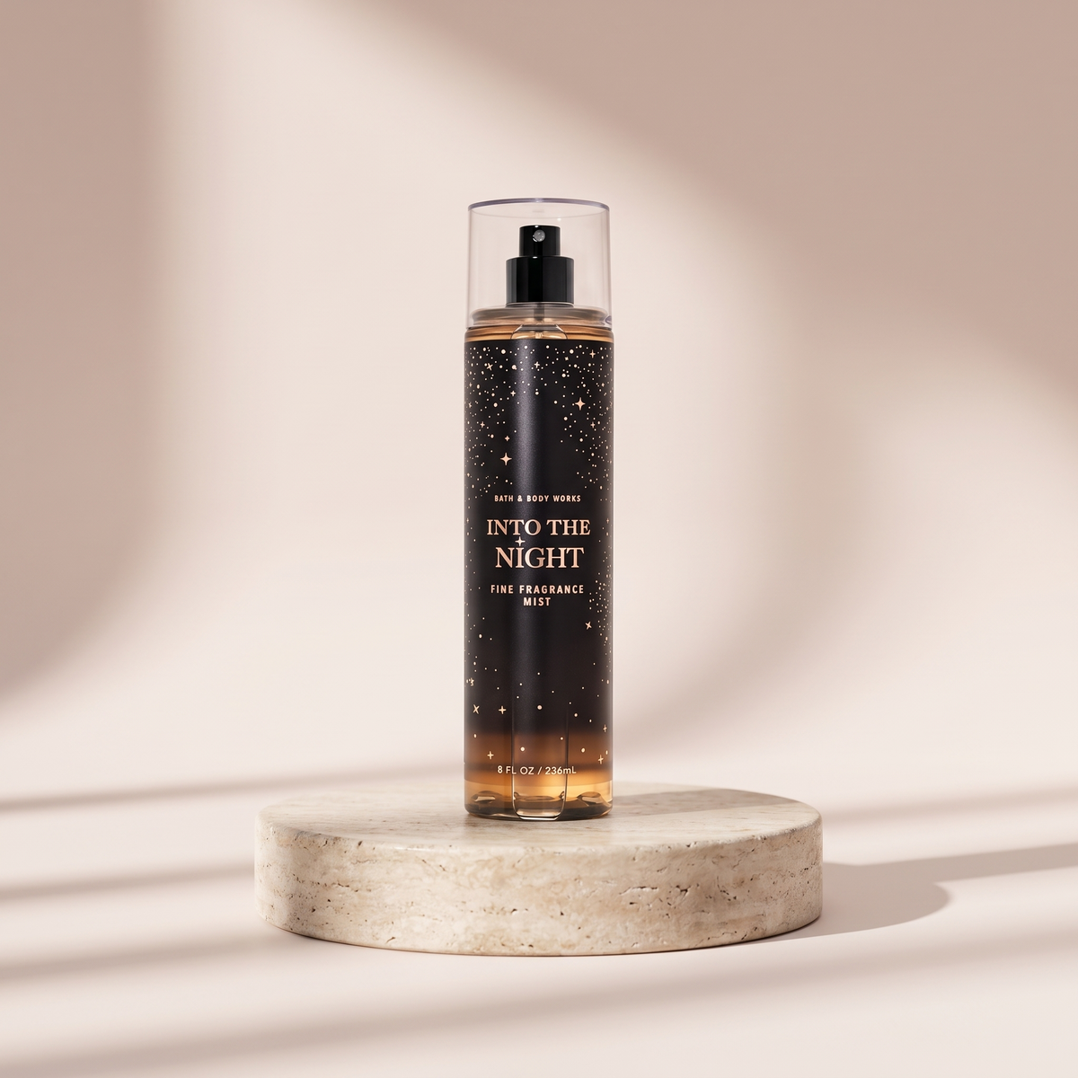 Bath and Body Works Into the Night Fine Fragrance Mist 236 ml styled on travertine pedestal, blush studio