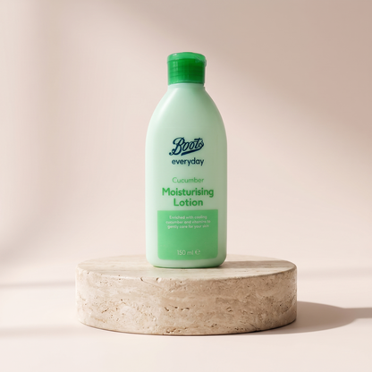 Boots Everyday Cucumber Moisturising Lotion 150 ml styled on travertine pedestal, blush studio