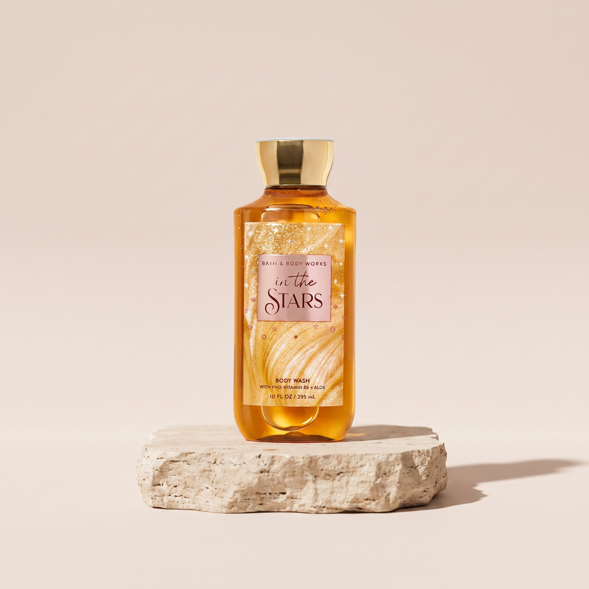 Bath and Body Works In The Stars Body Wash 295 ml styled on travertine pedestal, blush studio