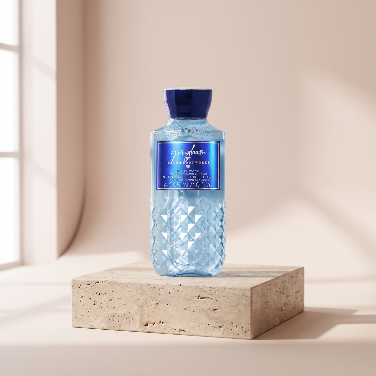 Bath and Body Works Gingham Body Wash 295 ml styled on travertine pedestal, blush studio
