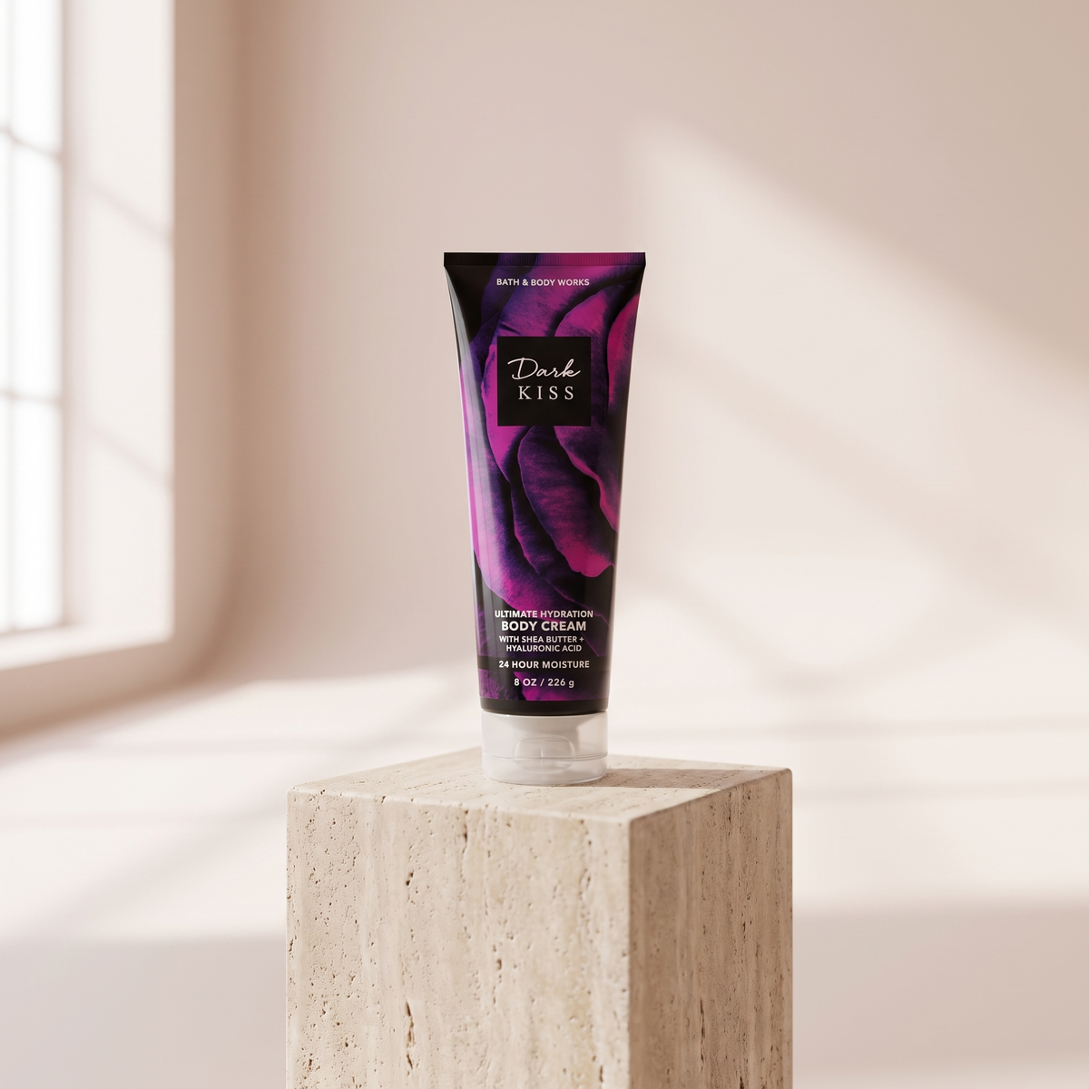 Bath and Body Works Dark Kiss Body Cream 226 g styled on travertine pedestal, blush studio