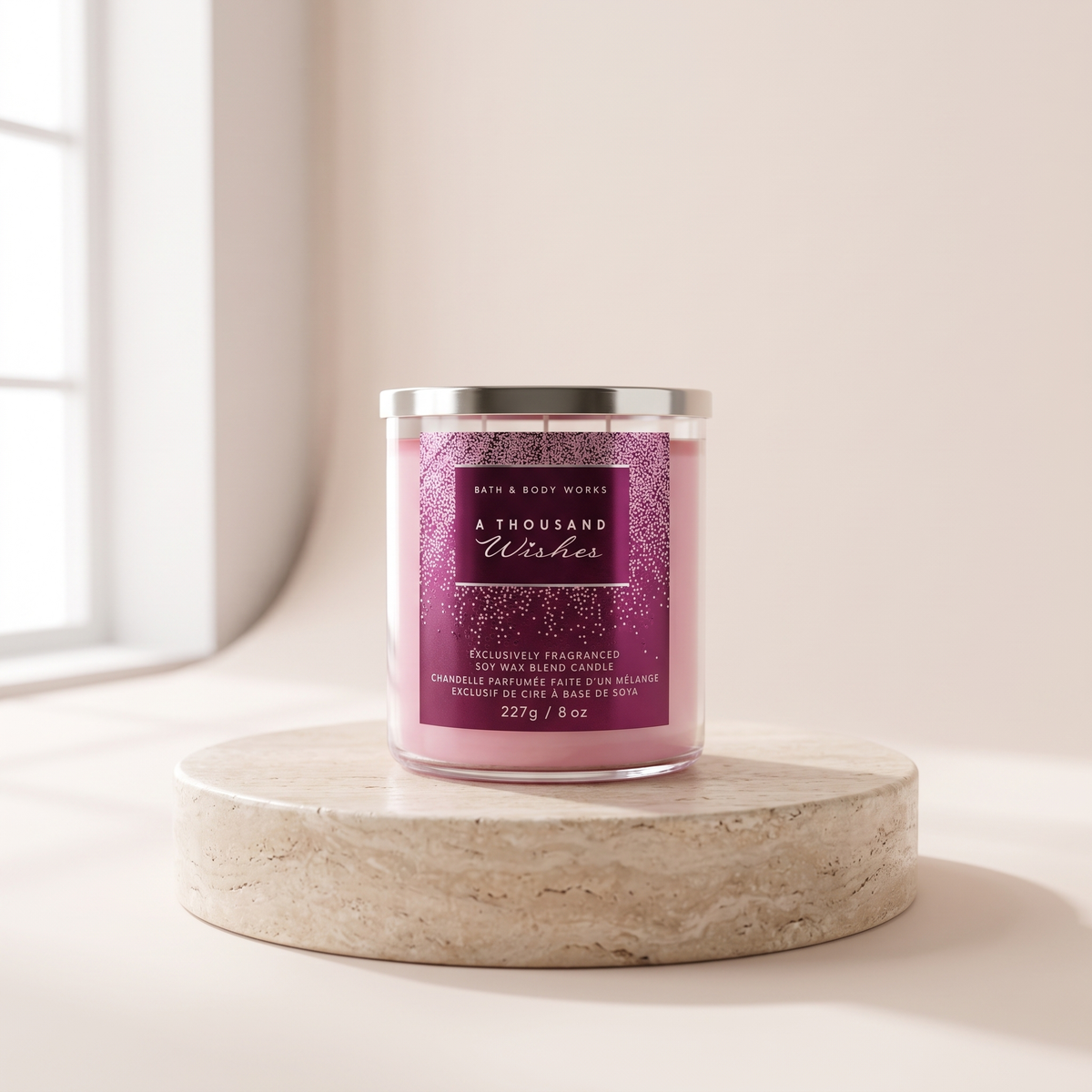 Bath and Body Works A Thousand Wishes Soy Wax Bean Candle styled on travertine pedestal, blush studio