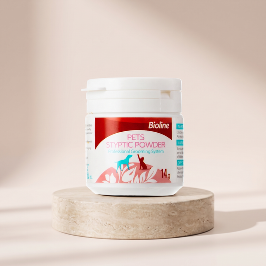 Bioline Styptic Powder quick stop bleeding formula styled on travertine pedestal, blush studio
