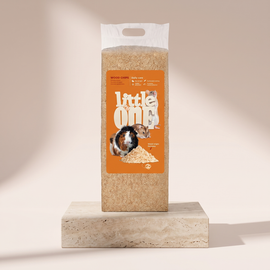 Little One Wood Chips small pet bedding styled on travertine pedestal, blush studio