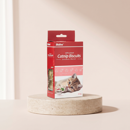 Bioline Catnip Biscuits salmon flavour cat treats styled on travertine pedestal, blush studio