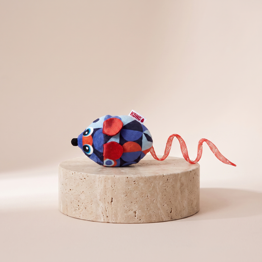 KONG Bat A Bout Flicker Mouse light up cat toy styled on travertine pedestal, blush studio